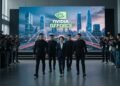 A CEO of a tech company being escorted by security personnel at a press conference in China, highlighting the serious nature of intellectual property protection and the global concern over chip theft.