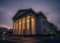 AS Akui Tempatkan Senjata di Luar Angkasa, China-Rusia Peringatkan Perang Antariksa A dramatic evening view of the Mahkamah Konstitusi building, symbolizing the legal process and the high-stakes nature of the gugatan ijazah case involving the Vice President.