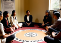 Vaksin COVID-19 segera Didistribusi ke 34 Provinsi A group of people sharing their feelings in a therapy session, highlighting the importance of mental health and support, with a therapist in the background and a poster emphasizing the unique pathways to mental well-being.
