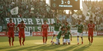 PSS Sleman players celebrate their victory over PSM Makassar in a Super League match. The stadium crowd, predominantly supporting PSS Sleman, watches as the final score is 3-0. PSM Makassar players lo