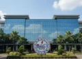 Tragedi Carstensz: Lilie Wijayati & Elsa Laksono Gugur di Puncak Impian The main building of BMKG in Jakarta stands prominently, with its glass facade and circular logo. The surrounding greenery and clear blue sky reflect the agency's commitment to environmental monitorin