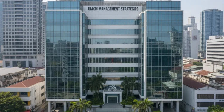 Strategi Manajemen Arus Kas UMKM Hadapi Ketidakpastian Pasar A modern office building with sleek glass facades and a signboard displaying 'UMKM Management Strategies' in a bustling business district. The interior is well-lit and decorated with green plants and