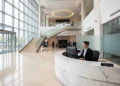 Unismuh Makassar Diserang OTK, Dua Mahasiswa Terluka Akibat Pukulan dan Panah A grand entrance hall of the National Broadcasting Center with large glass windows and a grand staircase leading to the main studio, symbolizing the transparency and importance of media in revealing t