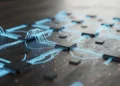 Kode CMD Untuk Mempercepat Kinerja Laptop Foto detail papan sirkuit modern dengan aliran data biru menyala yang mengalir antara mikrochip pada meja gelap.